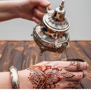 sand bottle, henna and wood